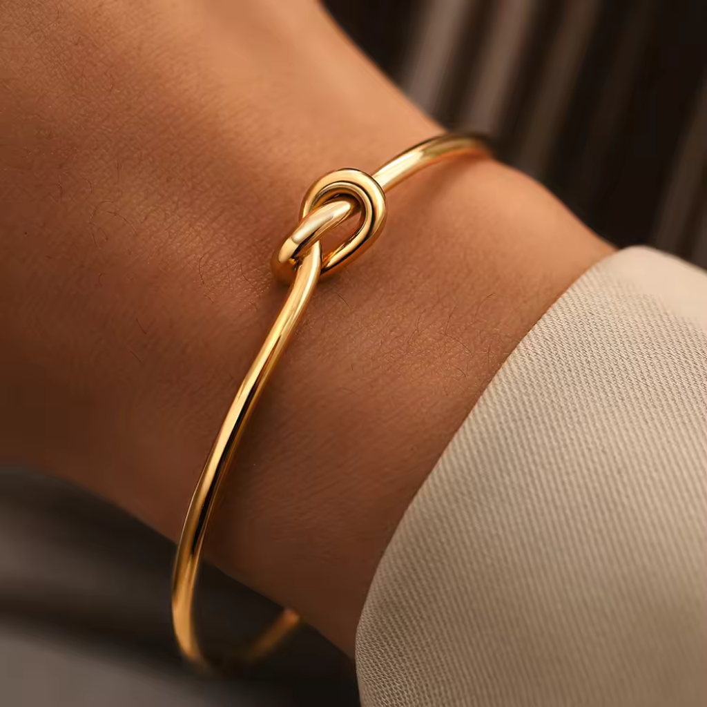 Gold plated cuff bracelet,
Knot design bangle,
Gold bangle bracelet,
Gold plated knot bracelet,
Elegant knot cuff,
Gold cuff bracelet with knot,
Gold plated bangle bracelet,
Knot detail bangle,
Sophisticated cuff bracelet,
Stylish gold knot bracelet,
Adjustable gold cuff bracelet,
Gold knot bangle,
Modern gold cuff bracelet,
Classic knot cuff bracelet,
Trendy gold plated bangle